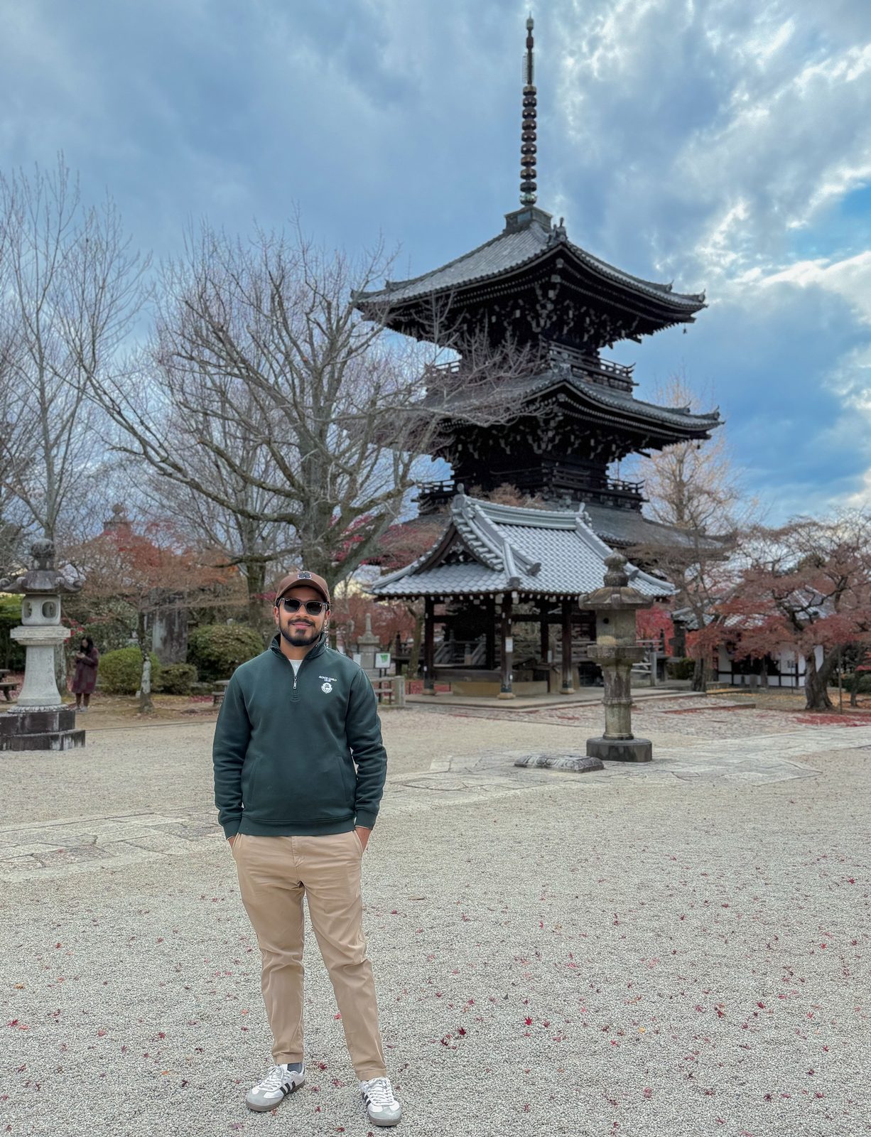 Faiq in front of a traditional multi-tiered pagoda in Kyoto