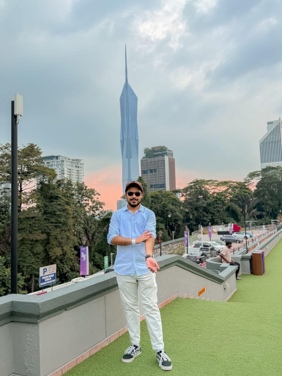 Faiq with Merdeka 118 tower rising behind him in Kuala Lumpur